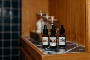 3 Cannabis Tincture bottles on a counter 