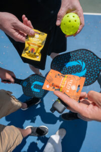 People holding disposable vapes outdoors