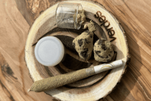 Cannabis products on a wooden tray 