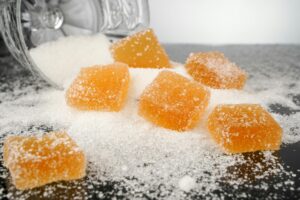 Close-up view of sugar-coated orange gummy candies